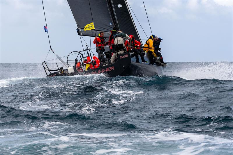 Scarlet Runner keeps pace with multihulls as they race down the Westcoast photo copyright Michael Currie taken at Ocean Racing Club of Victoria and featuring the IRC class