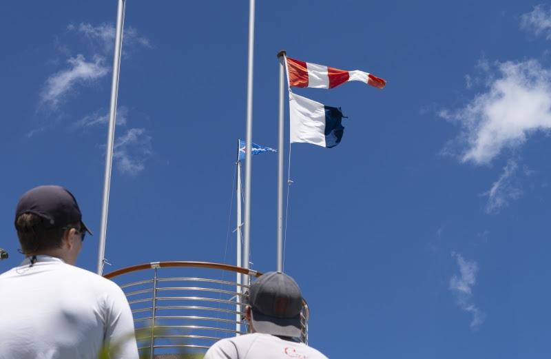 The AP over A flag, indicating no more racing for the day, hoisted today on the YCCS terrace overlooking Piazza Azzurra photo copyright YCCS / Daniele Macis taken at Yacht Club Costa Smeralda and featuring the J/24 class