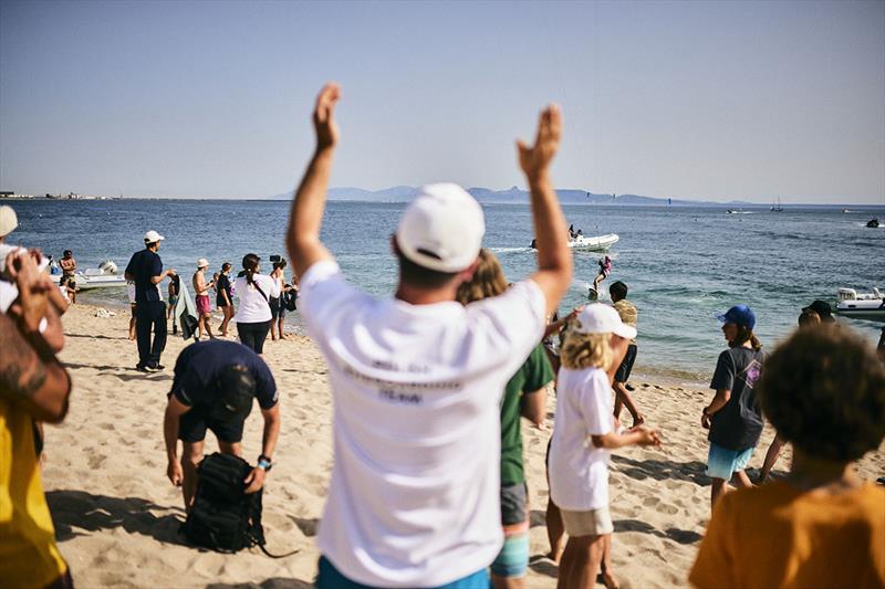 Nina Arcisz is welcomed ashore after her victory - Kitefoiling Youth World Championships  - photo © Robert Hajduk / IKA media