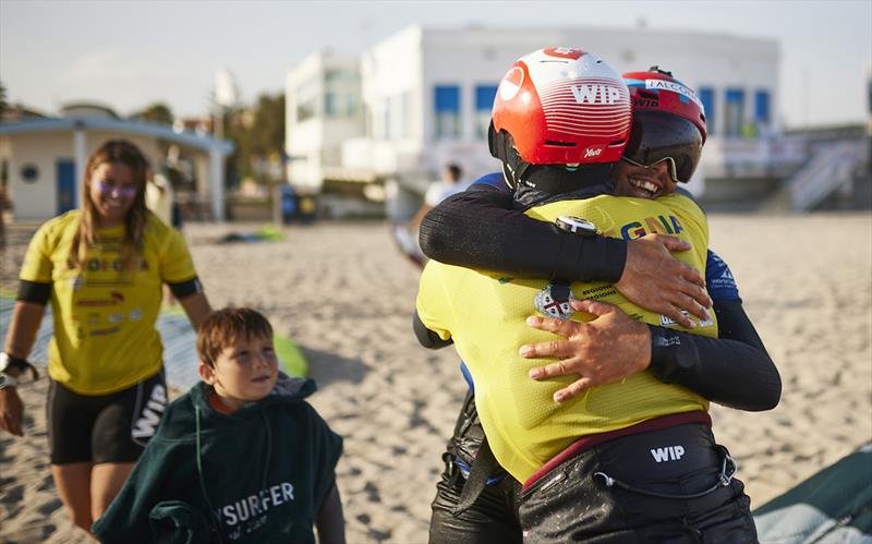 2023 Kitefoil World Series - Congratulatory hug for Maeder from silver medallist Boschetti - photo © IKA Media / Robert Hajduk