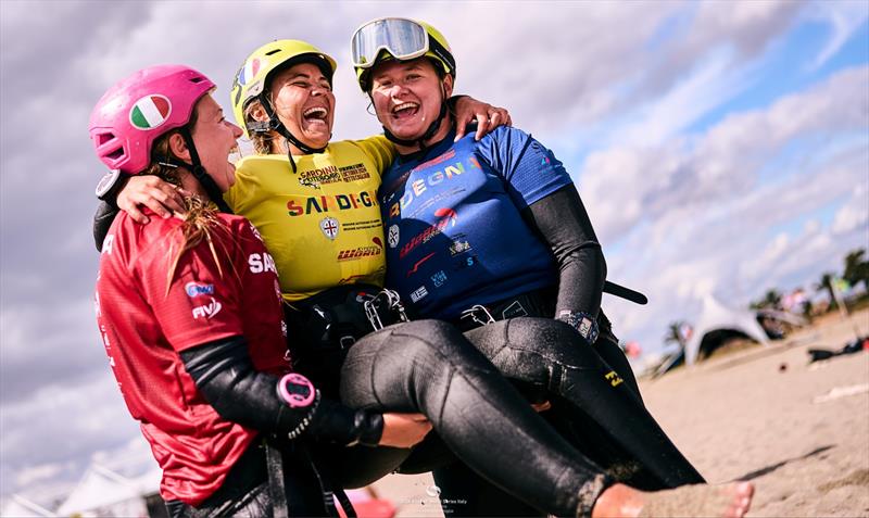 Kampman gets a lift from Pescetto (left) and Lengwiler (right) - 2024 KiteFoil World Series Sardinia - photo © IKA Media / Robert Hajduk