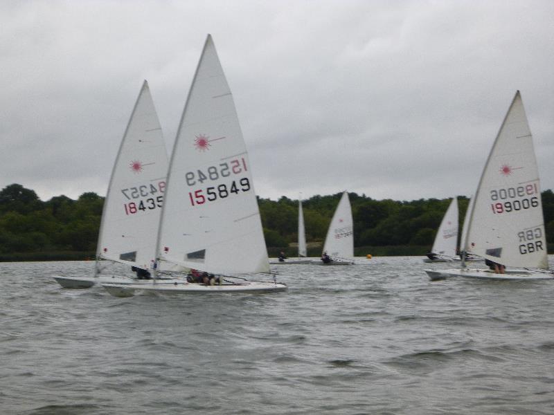 Lasers at Frensham Pond photo copyright www.clubsailor.co.uk taken at Frensham Pond Sailing Club and featuring the ILCA 7 class