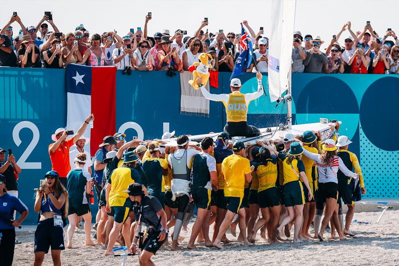 Matt Wearn gets carried out of the water in victory photo copyright Sailing Energy taken at Australian Sailing and featuring the ILCA 7 class