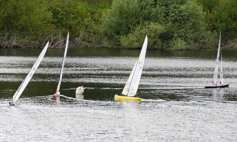 GAMES 6 Nylet RM Challenge Trophy: Shaun Wyeth (99) is already round the windward mark being chased by his son Lewis (77), David Cole (74) and Colin Harper (28) photo copyright Roger Stollery taken at Guildford Model Yacht Club and featuring the Marblehead class