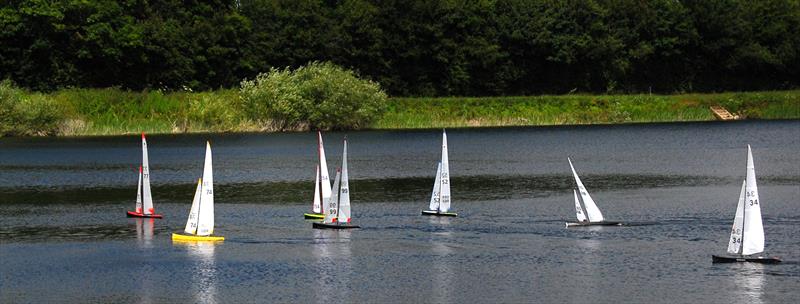 GAMES 6 Nylet RM Challenge Trophy: the fleet approaching the windward mark with Lewis leading the pack in a turbulent wind with very strong gusts photo copyright Roger Stollery taken at Guildford Model Yacht Club and featuring the Marblehead class