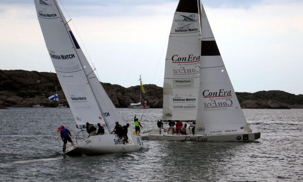 Philippe Presti crosses ahead of Staffan Lindberg on Day 2 of the Swedish Match Cup photo copyright Swedish Match Tour / Sean McNeill taken at  and featuring the Match Racing class