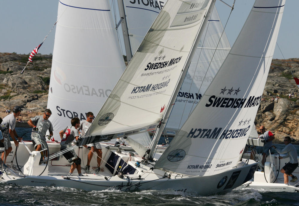 Ed Baird (left) takes Lars Nordbjerg’s transom after being penalized on the second windward leg during day 4 of the Swedish Match Cup photo copyright Swedish Match Tour / Guido Cantini taken at  and featuring the Match Racing class