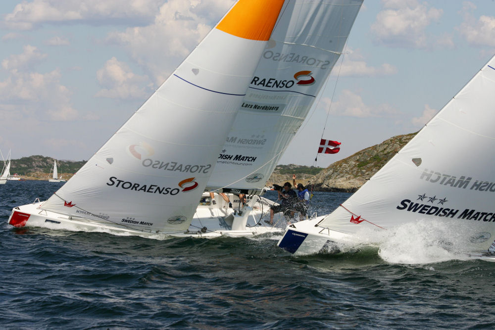 Lars Nordbjerg (left) and Ed Baird work upwind during their third and deciding match in the knockout round of the Swedish Match Cup photo copyright Swedish Match Tour / Guido Cantini taken at  and featuring the Match Racing class