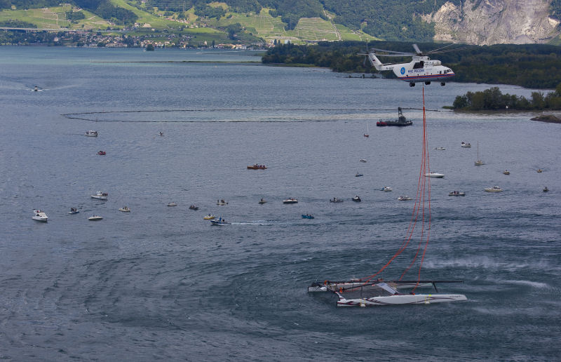 Alinghi launches its giant catamaran on Lake Geneva by helicopter photo copyright Stefano Gattini / Alinghi taken at  and featuring the Maxi Cat class