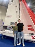 Oliver Groves and Esther Parkhurs, 2024 Endeavour Trophy winners in front of the Melges 15 at the RYA Dinghy & Watersports Show 2025 © Melges UK