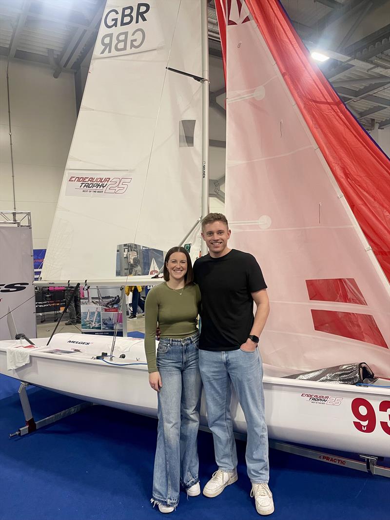 Oliver Groves and Esther Parkhurs, 2024 Endeavour Trophy winners in front of the Melges 15 at the RYA Dinghy & Watersports Show 2025 - photo © Melges UK