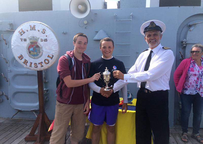 Captain David Price awards the HMS Bristol Regatta Trophy to Tom Wilkinson and Frank Leslie photo copyright Liz Rushall taken at 