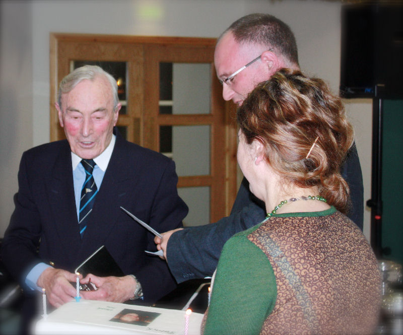 A retirement gift is given to Patrick Ryan who in his 90th year has reitred after 25 years of service as bar steward at Helensburgh Sailing Club photo copyright Kevin Lynch taken at Helensburgh Sailing Club