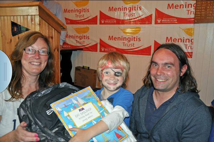 Heather Kane, wife of the EABC Commodore, with Freddie & Gavin Doig - winners of the Meningitis Minor Race photo copyright Tom Jobling taken at East Antrim Boat Club