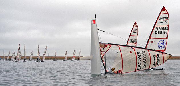 ACO Musto Skiff worlds sees new moves invented in light winds photo copyright Tania Samus / www.photoskiff.com taken at Weymouth & Portland Sailing Academy and featuring the Musto Skiff class