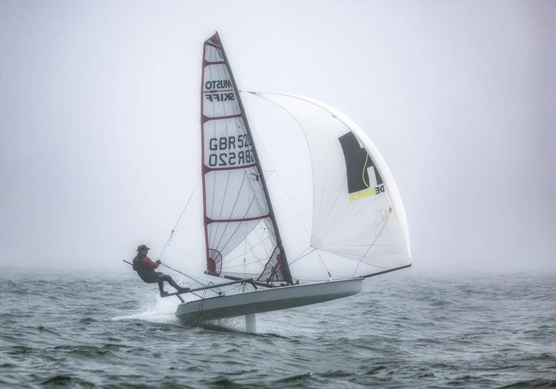 Graeme Oliver – Sailing through fog at the 2024 Musto Skiff Open photo copyright Michael Oliver taken at Itchenor Sailing Club and featuring the Musto Skiff class