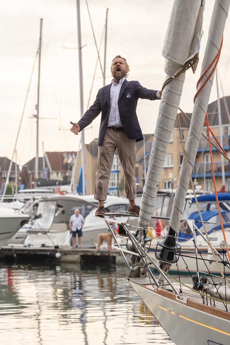 McIntyre Ocean Globe 2023 – Ville Nora, has been part of theFinnish National Opera Choir and now entertains the crowds singing “At Sea” as Galiana WithSecure FI (06) leaves to sail around the World - photo © Tim Bishop / PPL