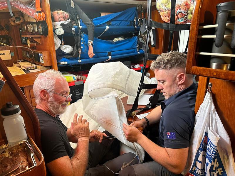 Ocean Globe Race - Top bunk on Outlaw providing best vantage spot for watching your crew mates work hard fixing a torn sail - photo © Team Outlaw / OGR