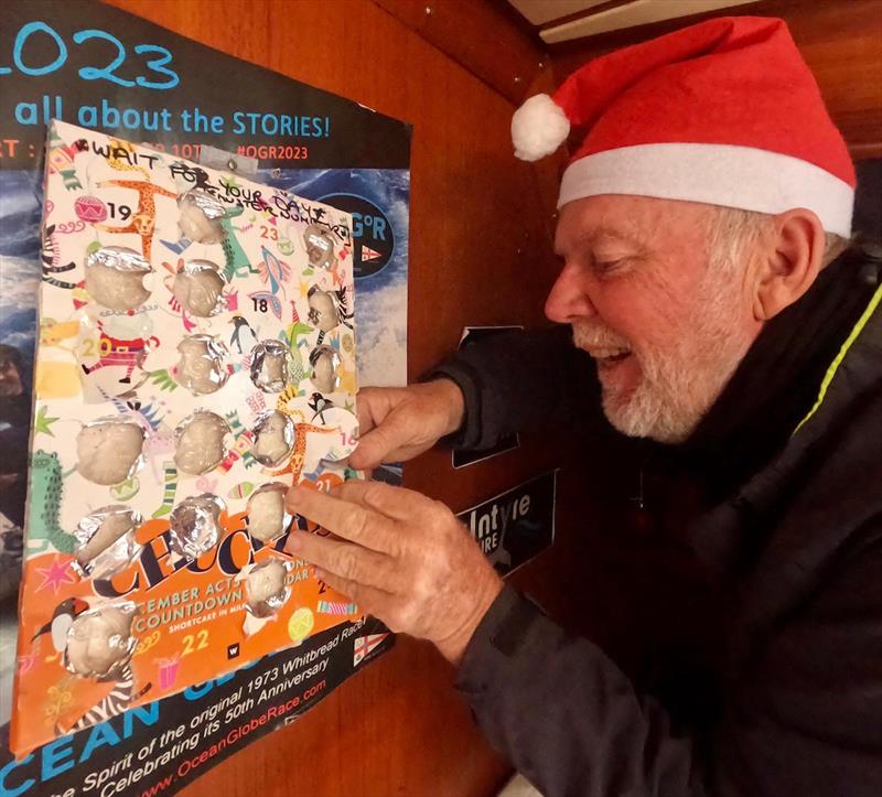 It's Skipper Mark Sinclair's AKA Capt. Coconut's turn to open the advent calendar - photo © OGR2023 / Explorer