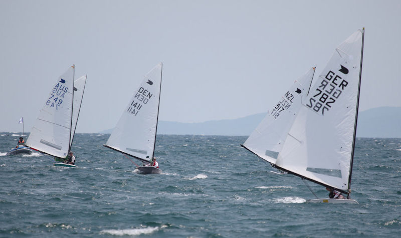 Andre Budzien leads race 5 on day 3 of the Singa OK Dinghy Worlds photo copyright Malee Whitcraft taken at Royal Varuna Yacht Club and featuring the OK class