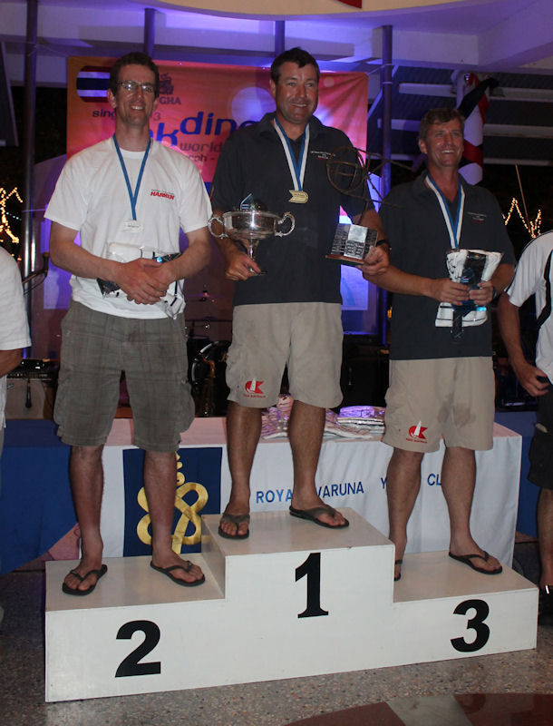 Singa OK Dinghy Worlds 2013 podium (l to r) Nick Craig (2nd), Roger Blasse (1st), Michael Williams (3rd) photo copyright Robert Deaves taken at Royal Varuna Yacht Club and featuring the OK class