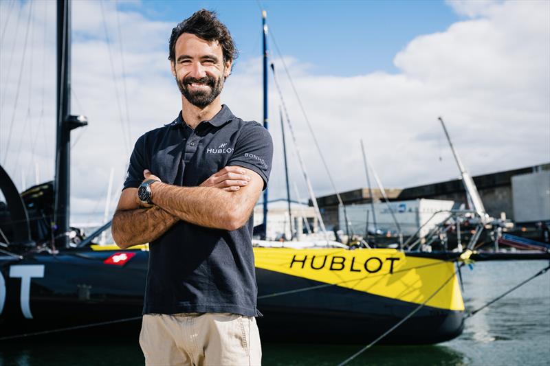 Hublot Sailing Team Skipper Alan Roura, in front of his IMOCA sailing boat in Lorient, France - photo © Jean-Louis Carli