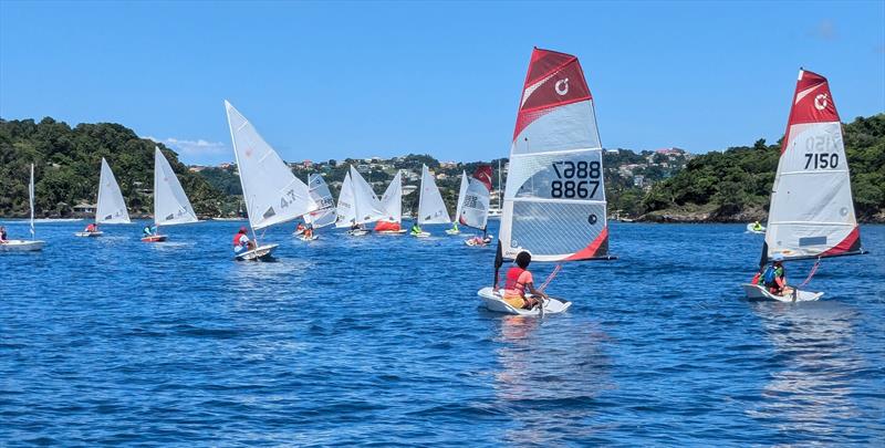 Light winds in Calliaqua Bay during the CG United Insurance SVG Youth National Sailing Championships 2024 photo copyright Jenny Trumble taken at  and featuring the O'pen Skiff class