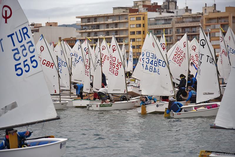 Return of the fleet after the day. - 35th Palamós Optimist Trophy 2025 photo copyright Alfred Farré taken at Club de Vela Palamos and featuring the Optimist class