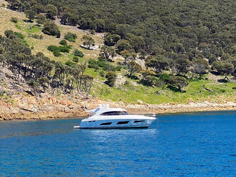 The Cinnerari's Dory, a 4800 Sport Yacht riding quietly at anchor at Deal Island photo copyright Riviera Australia taken at  and featuring the Power boat class