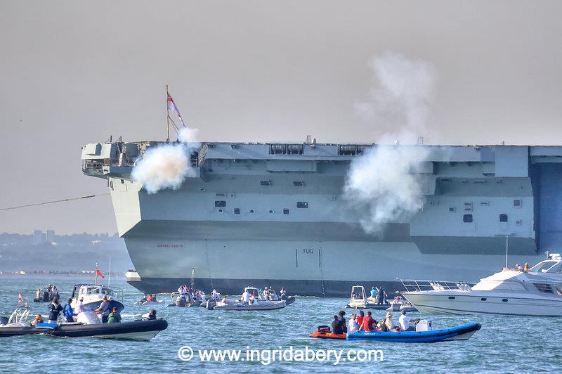 HMS Queen Elizabeth's salute exchange with the Royal Yacht Squadron - photo © Ingrid Abery / www.ingridabery.com