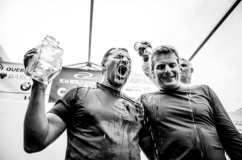 Vladimir Prosikhin and tactician Dean Barker drenched in celebratory champagne at the RC44 Cascais Cup photo copyright Pedro Martinez / Martinez Studio taken at Clube Naval de Cascais and featuring the RC44 class