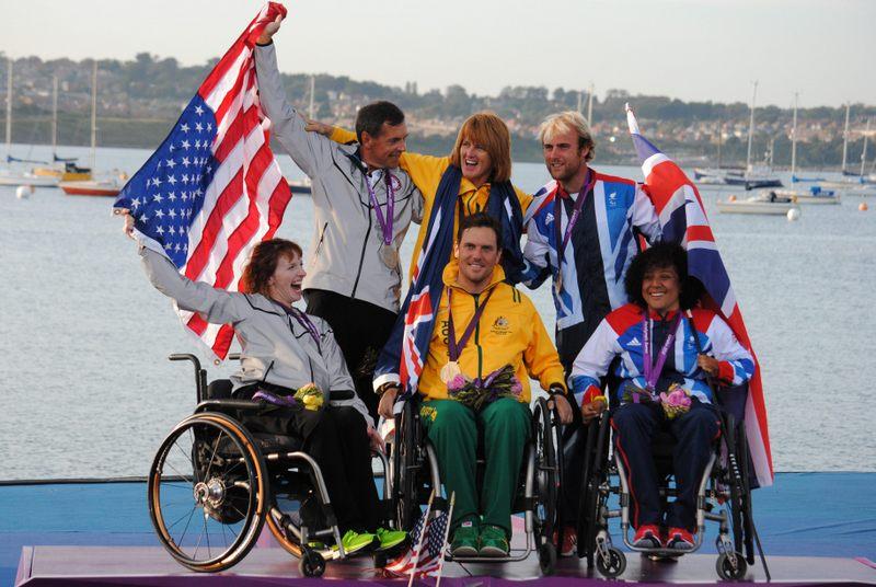 Medal ceremony for the SKUD 18 class at the London 2012 Paralympics photo copyright IFDS taken at Weymouth & Portland Sailing Academy and featuring the SKUD 18 class