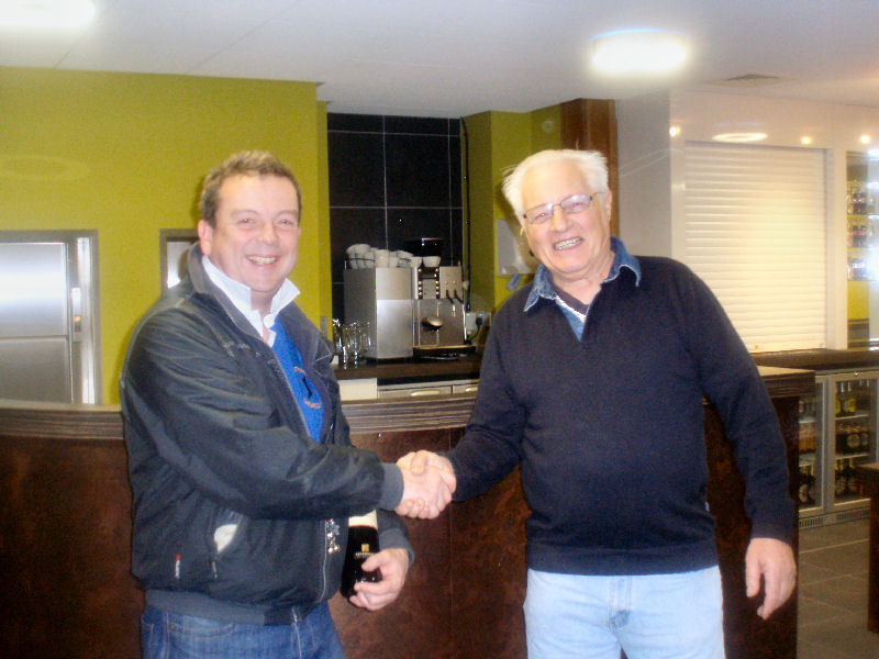 Martin Hartley receiving the team prize from Crosby Commodore Spud Ward after their first open meeting at the newly opened Crosby Lakeside Activities Centre photo copyright Crosby SC press office taken at Crosby Sailing Club and featuring the Solo class