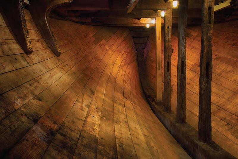 The view aft in the restored hold, looking as it did when the Charles W. Morgan was built in 1841. The stanchions at right show wear from the chafing of oil casks during whaling voyages - photo © Andy Price (Mystic Seaport Museum, D2-13-06-0621)