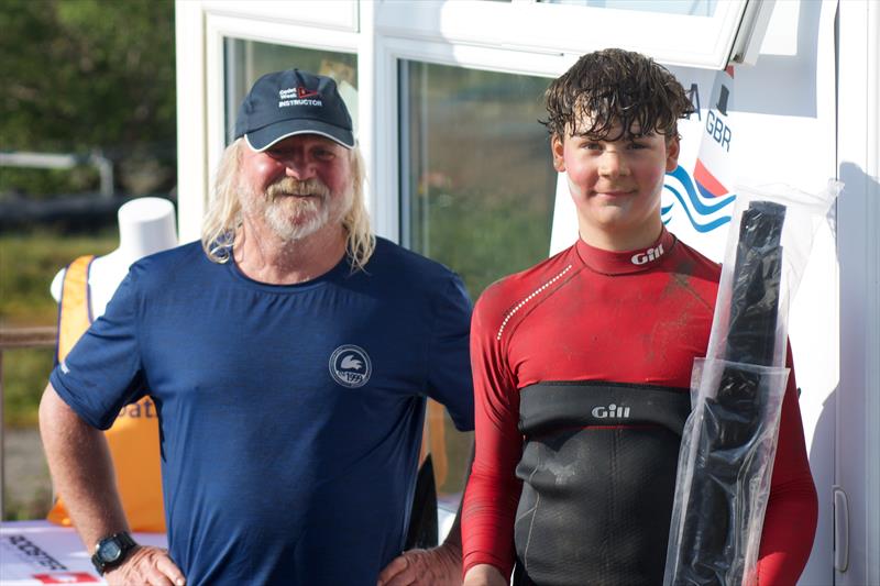 Development Trophy presented to Laurie Lamb (Draycote Water SC) by John Eaton, Race Officer SBSC, during the Topper Eastern Area Championships at Snettisham Beach photo copyright John Blackman Northwood taken at Snettisham Beach Sailing Club and featuring the Topper class