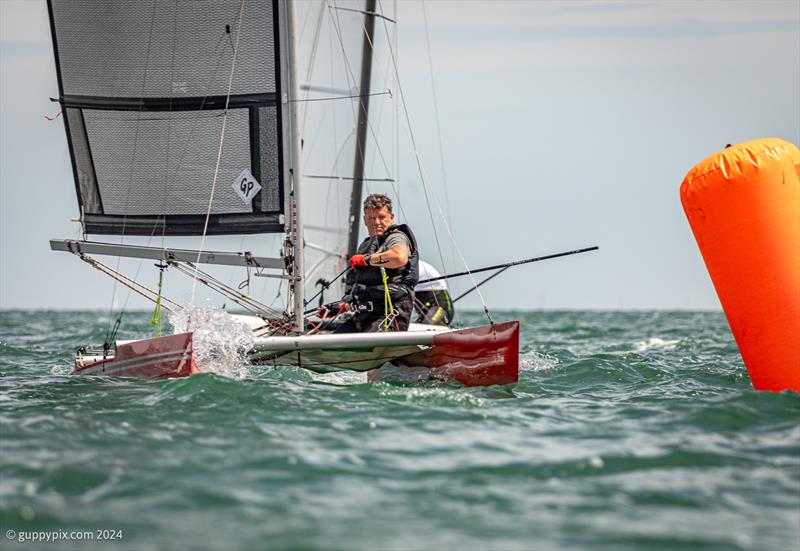 Dan Jarman's race face as he sails to a Championship win during the Unicorn and A Class Catamaran Nationals at Hayling Ferry SC photo copyright Gordon Upton / www.guppypix.com taken at Hayling Ferry Sailing Club and featuring the Unicorn class