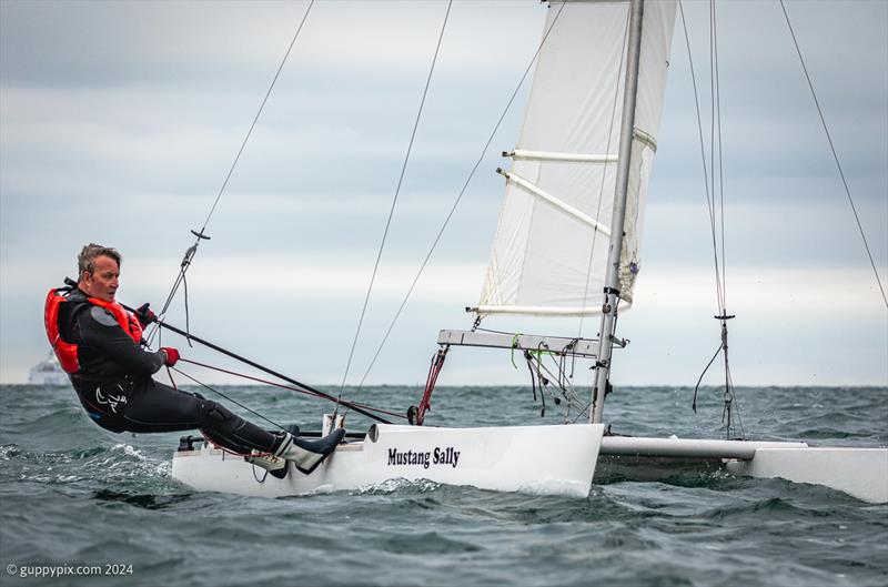 Richard Beke, classic car and Wilson Picket enthusiast, during the Unicorn and A Class Catamaran Nationals at Hayling Ferry SC photo copyright Gordon Upton / www.guppypix.com taken at Hayling Ferry Sailing Club and featuring the Unicorn class