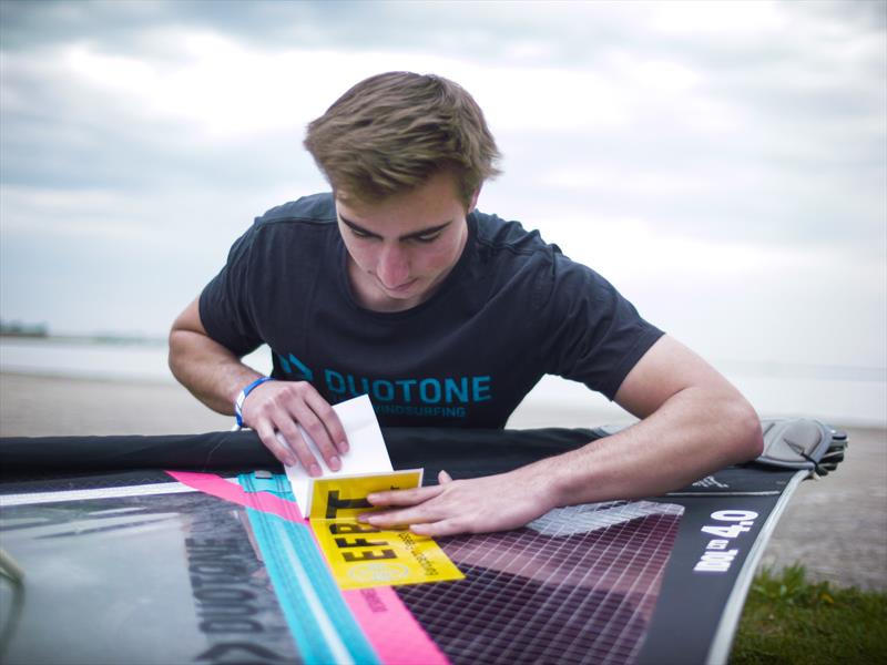 Nico Karner carefully placing his yellow EFPT sticker, is he going to be tour leader in the future? - photo © Freestyle Pro Tour