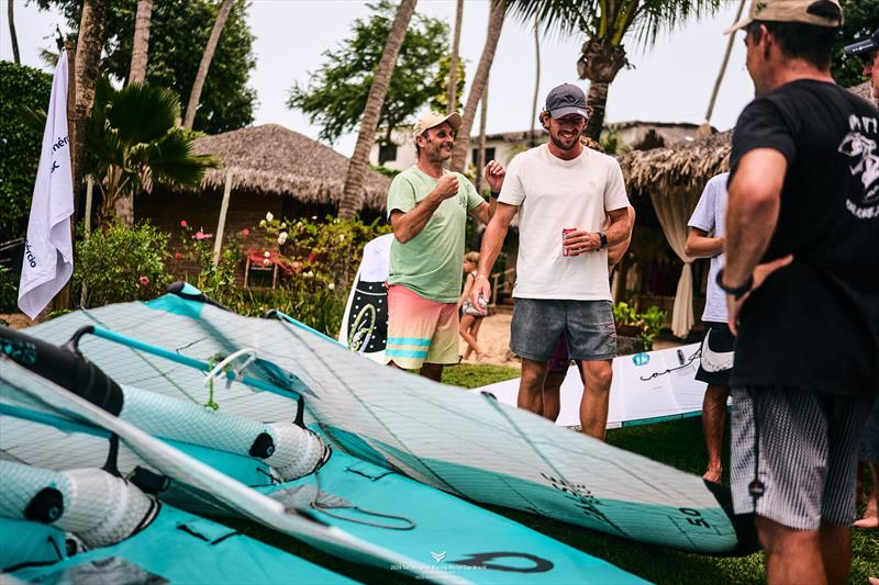 Bastien Escofet (right) having a laugh with race officer Mirco Babini - 2024 WingFoil Racing World Cup Brazil photo copyright IWSA media/ Robert Hajduk taken at  and featuring the Wing Foil class